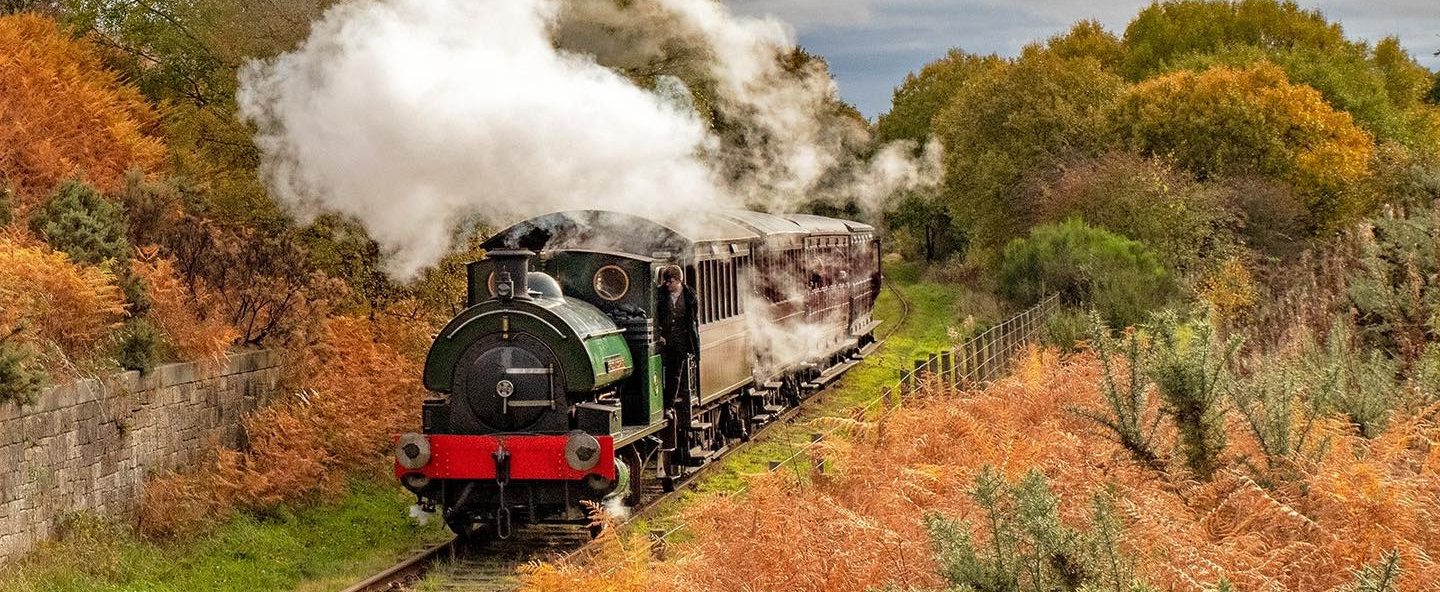295758828_10160616214235312_1114595440458162205_n a train on a track with smoke coming out of it