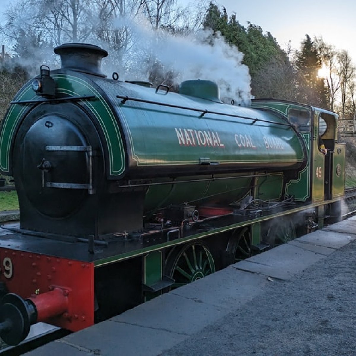 a train engine carrying carts down a track