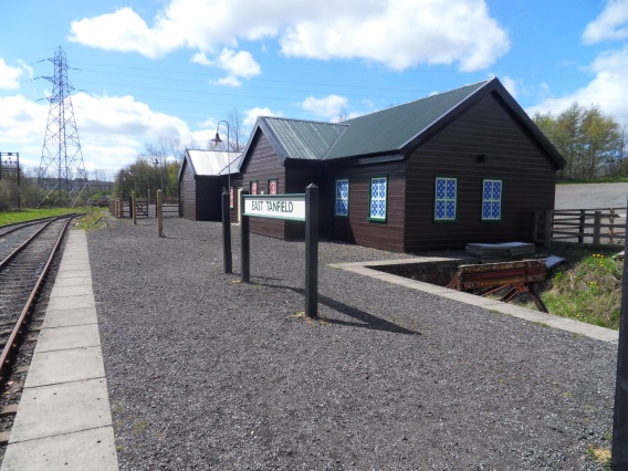 a train is parked on the side of a house