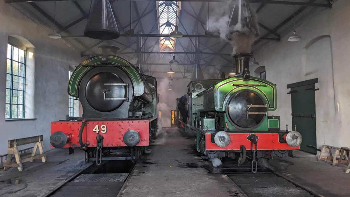 a steam train at a train station