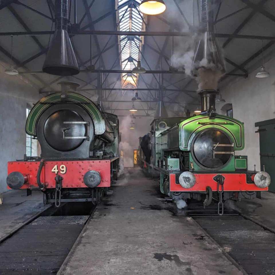 a steam train at a train station